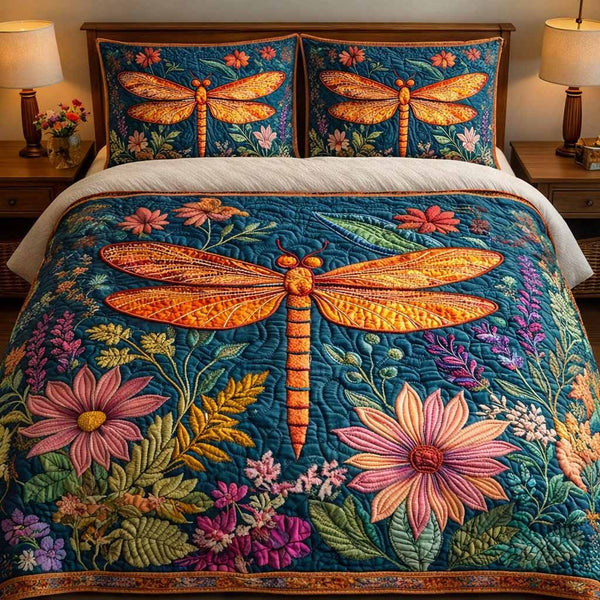 Coral Meadow quilted 3-piece bedding set on a made bed in a light coastal bedroom