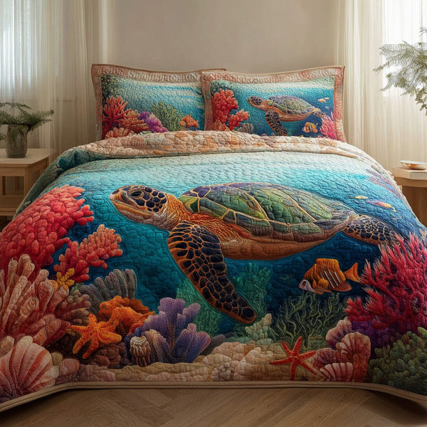Coral Odyssey quilted 3-piece bedding set on a made bed in a light coastal bedroom