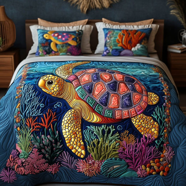 Coral Pathways quilted 3-piece bedding set on a made bed in a light coastal bedroom