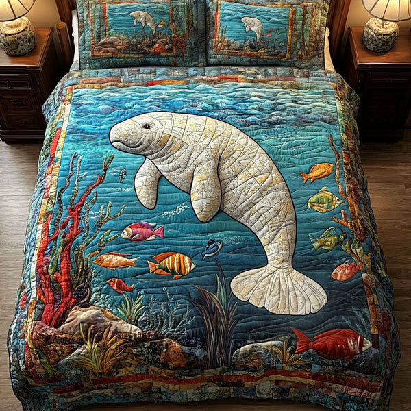Coral Reef Manatee quilted 3-piece bedding set on a made bed in a light coastal bedroom