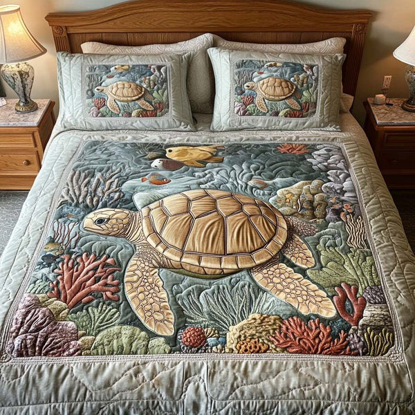 Coral Reef quilted 3-piece bedding set on a made bed in a light coastal bedroom