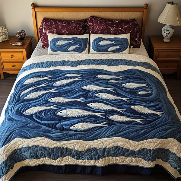 Coral Reef quilted 3-piece bedding set on a made bed in a light coastal bedroom