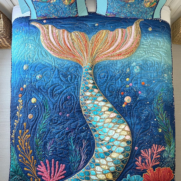 Coral Reef Wanderers quilted 3-piece bedding set on a made bed in a light coastal bedroom