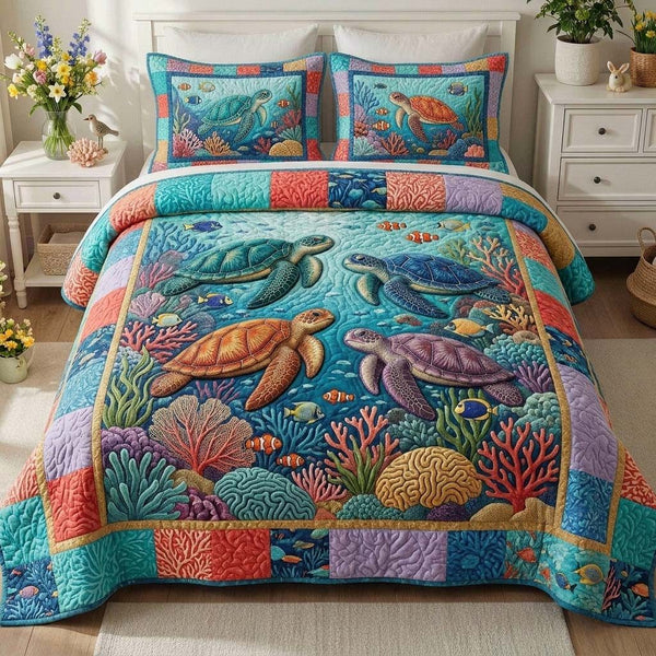 Coral Turtle Reef quilted 3-piece bedding set on a made bed in a light coastal bedroom