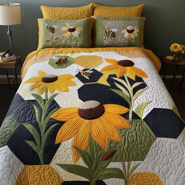 Cornflower Cascade quilted 3-piece bedding set on a made bed with two matching pillow shams
