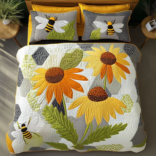 Cornflower Serenity quilted 3-piece bedding set on a made bed with two matching pillow shams