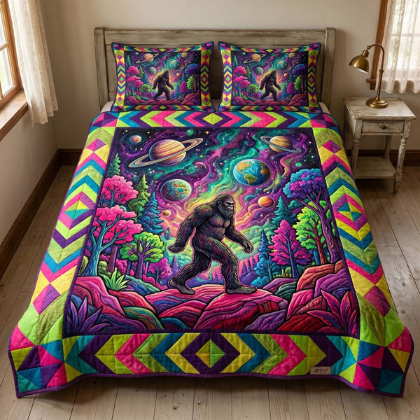 Cosmic Bigfoot quilted 3-piece bedding set on a made bed with two matching pillow shams