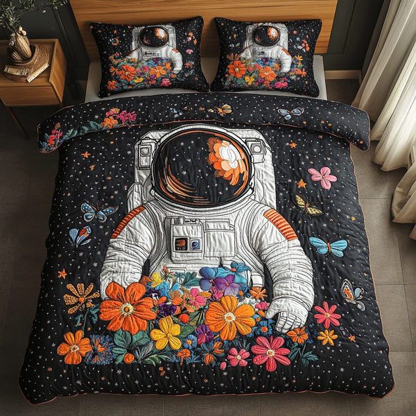 Cosmic Pioneer quilted 3-piece bedding set on a made bed with two matching pillow shams