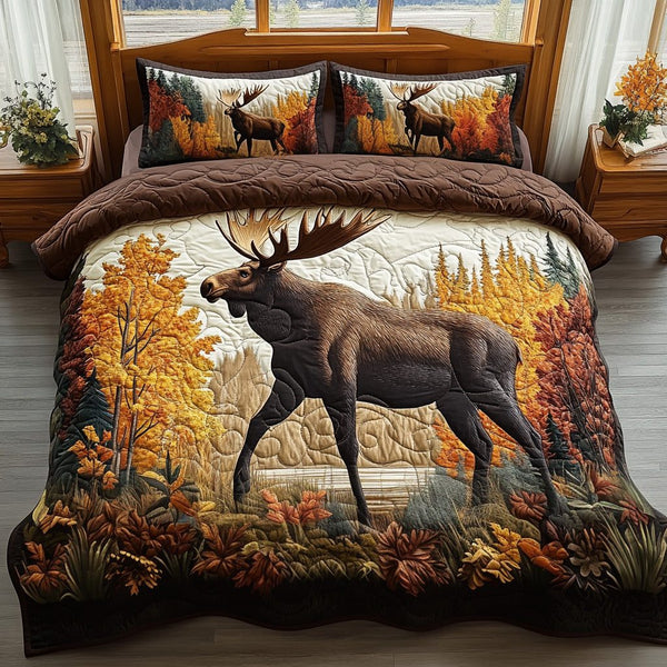 Cozy Antlers quilted 3-piece bedding set on a made bed with two matching pillow shams