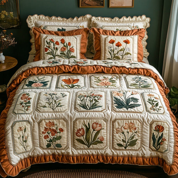 Cozy Blossoms quilted 3-piece bedding set on a made bed with two matching pillow shams