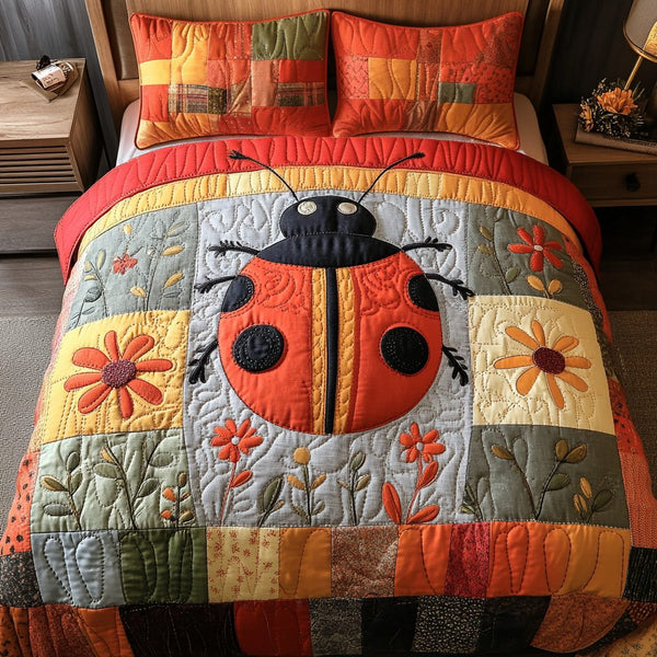 Cozy Bug quilted 3-piece bedding set on a made bed with two matching pillow shams