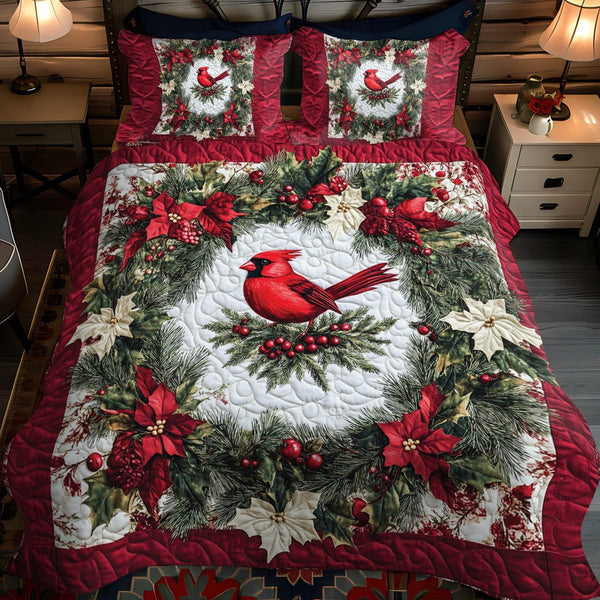 Cozy Cardinal Nest quilted 3-piece bedding set on a made bed with two matching pillow shams