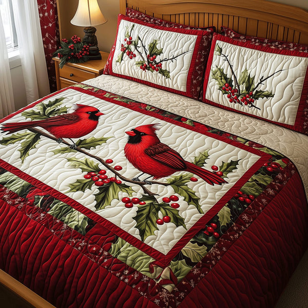 Cozy Cardinal Pair quilted 3-piece bedding set on a made bed with two matching pillow shams