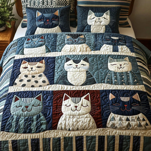 Cozy Cat Comet quilted 3-piece bedding set on a made bed with two matching pillow shams