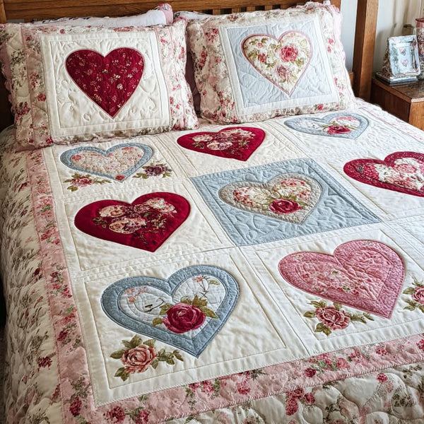 Cozy Hearts quilted 3-piece bedding set on a made bed with two matching pillow shams