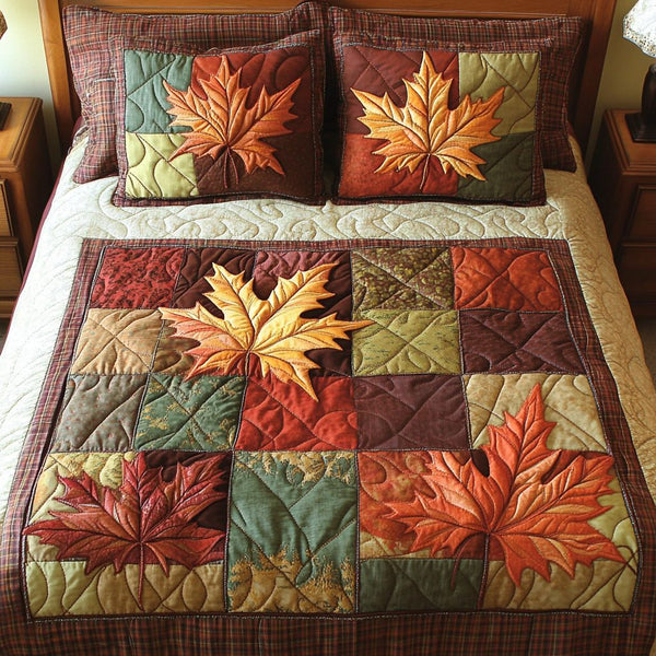 Cozy Leaves quilted 3-piece bedding set on a made bed with two matching pillow shams