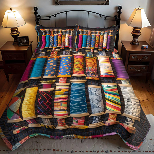 Crafty Spools quilted 3-piece bedding set on a made bed with two matching pillow shams