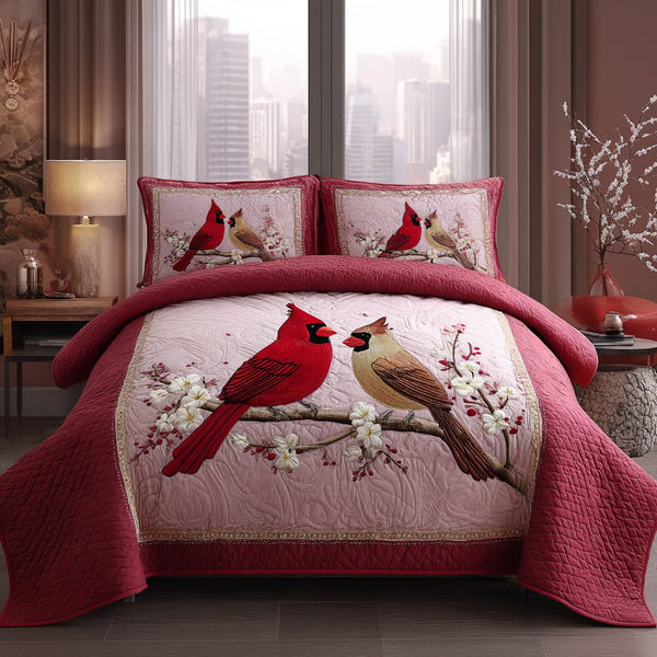 Crimson Beauty quilted 3-piece bedding set on a made bed with two matching pillow shams