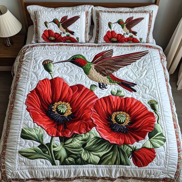 Crimson Bloom quilted 3-piece bedding set on a made bed with two matching pillow shams