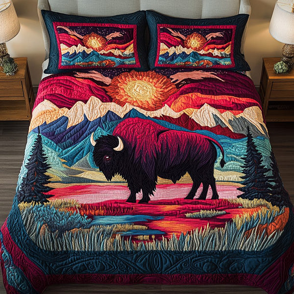 Crimson Dusk quilted 3-piece bedding set on a made bed with two matching pillow shams