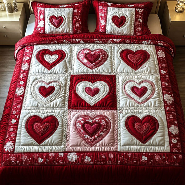 Crimson Glow quilted 3-piece bedding set on a made bed with two matching pillow shams