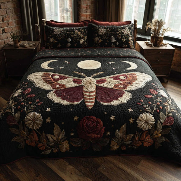 Crimson Moth quilted 3-piece bedding set on a made bed with two matching pillow shams