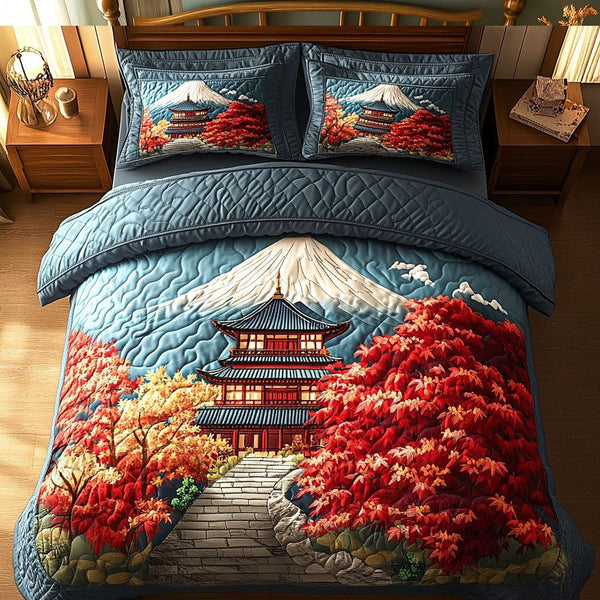 Crimson Pagoda quilted 3-piece bedding set on a made bed with two matching pillow shams