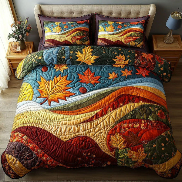 Crimson Sunset quilted 3-piece bedding set on a made bed with two matching pillow shams