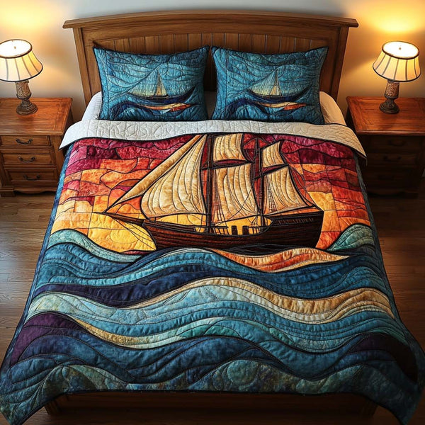 Crimson Voyage quilted 3-piece bedding set on a made bed with two matching pillow shams