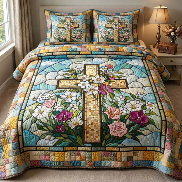 Cross Of Grace quilted 3-piece bedding set on a made bed in a softly lit bedroom