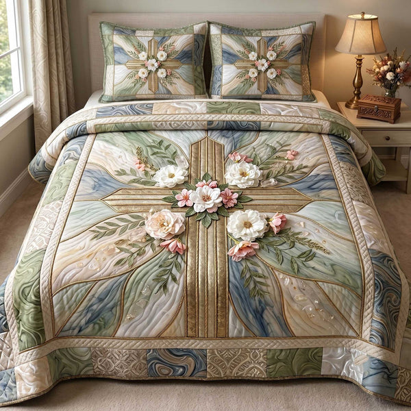 Cross Of Grace quilted 3-piece bedding set on a made bed in a softly lit bedroom