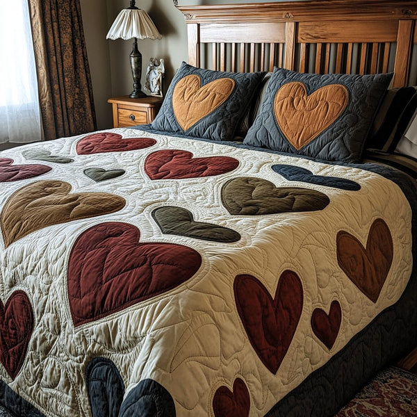Cuddle Hearts quilted 3-piece bedding set on a made bed with two matching pillow shams