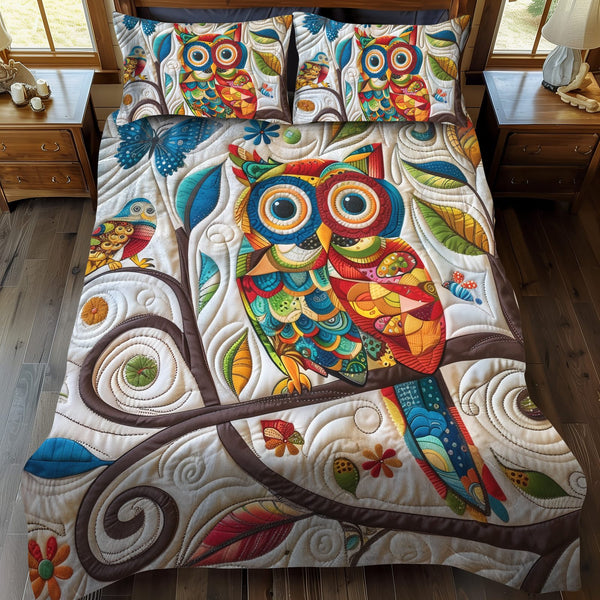 Cute Owl quilted 3-piece bedding set on a made bed with two matching pillow shams