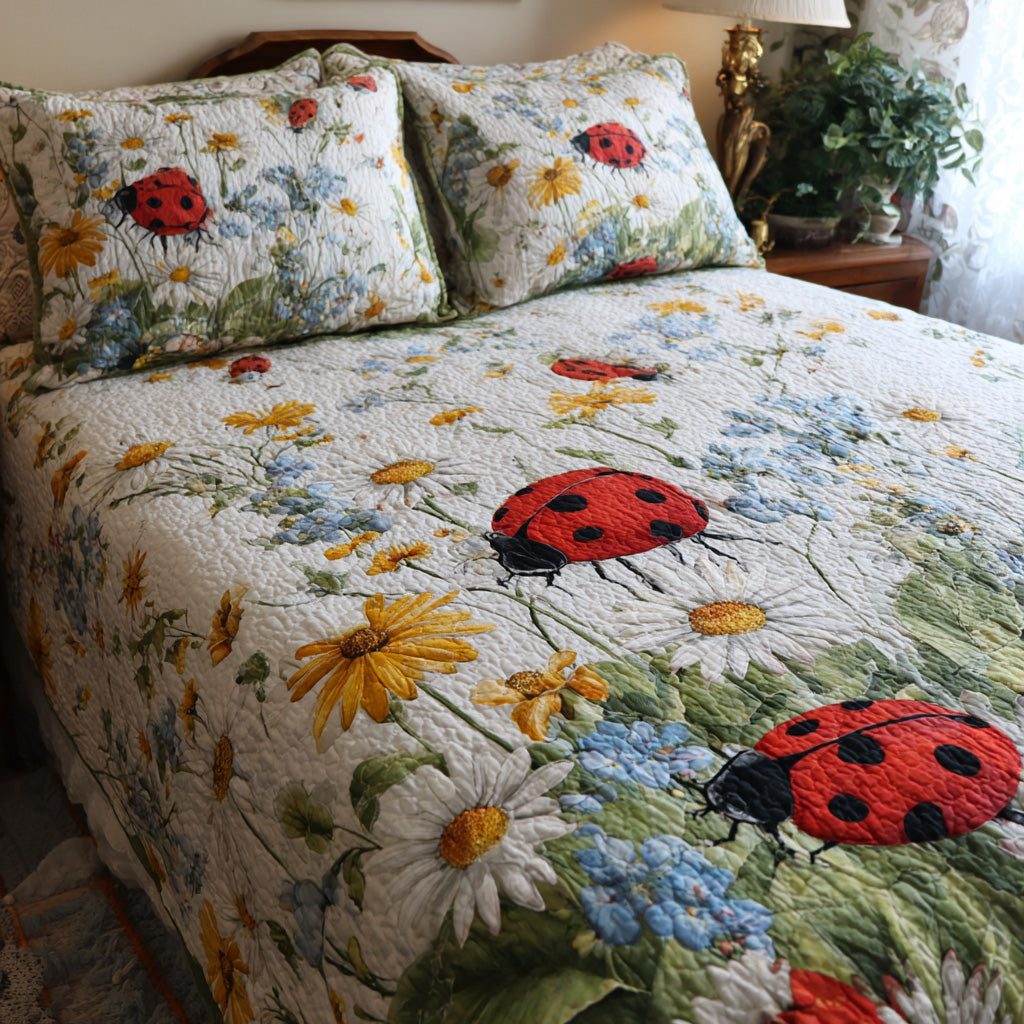 Daisy Dots quilted 3-piece bedding set on a made bed with two matching pillow shams