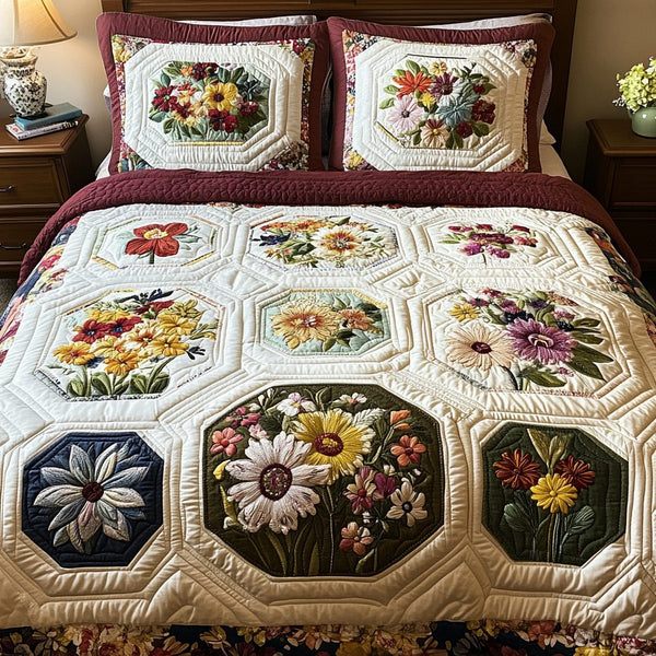 Daisy Drift quilted 3-piece bedding set on a made bed with two matching pillow shams