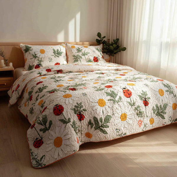 Daisy Drift quilted 3-piece bedding set on a made bed with two matching pillow shams