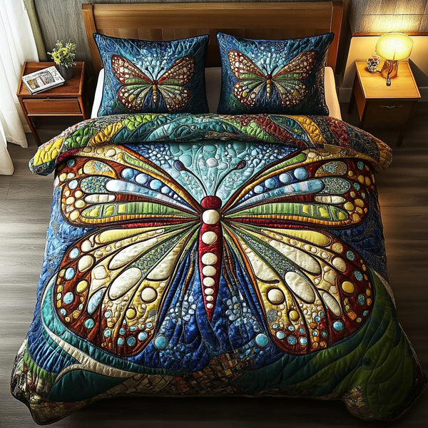 Dancing Breeze quilted 3-piece bedding set on a made bed with two matching pillow shams