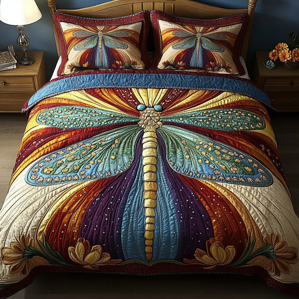 Dancing Dragonfly quilted 3-piece bedding set on a made bed with two matching pillow shams