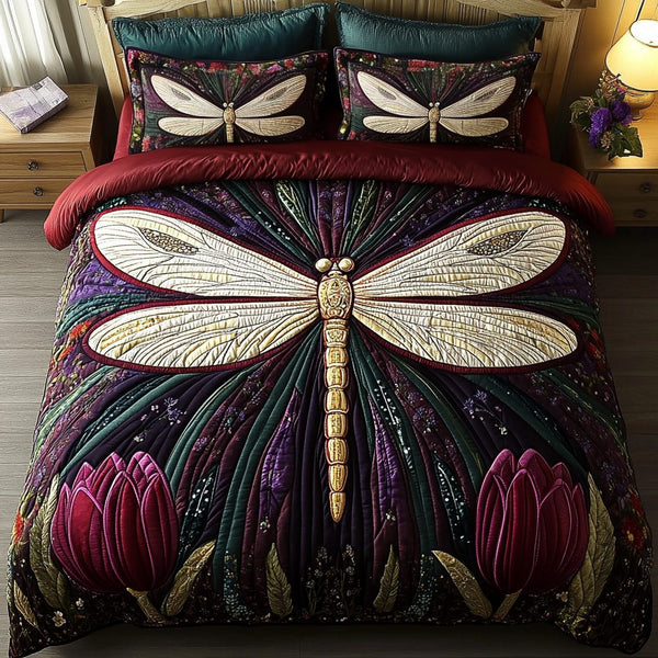 Dancing Dragonfly quilted 3-piece bedding set on a made bed with two matching pillow shams
