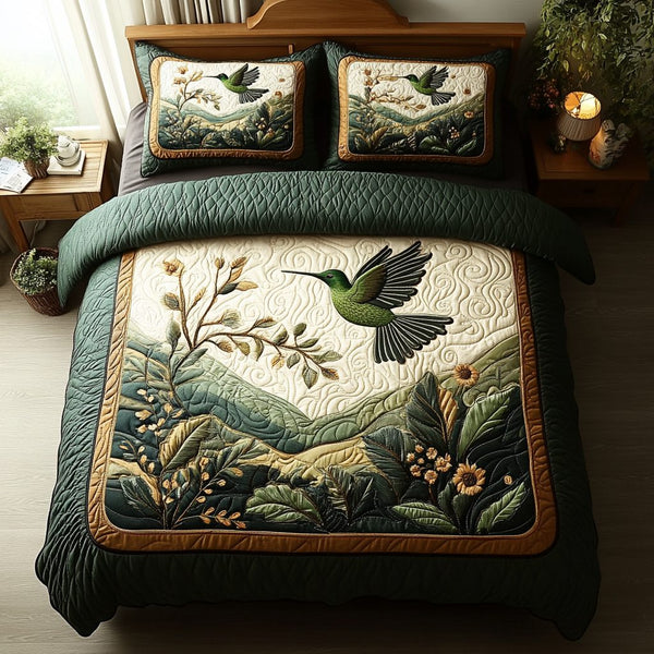 Dancing Feathers quilted 3-piece bedding set on a made bed with two matching pillow shams