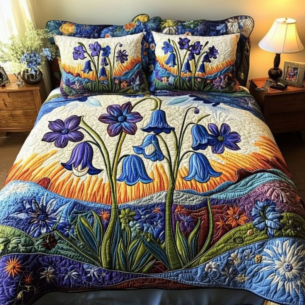 Dawn Blossom quilted 3-piece bedding set on a made bed with two matching pillow shams