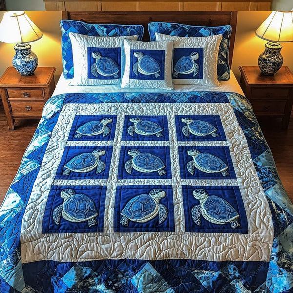 Deep Blue Charm quilted 3-piece bedding set on a made bed with two matching pillow shams