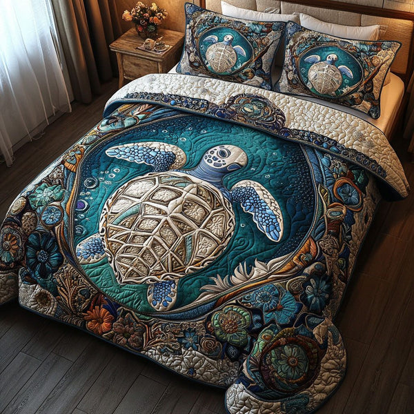 Deep Blue Escape quilted 3-piece bedding set on a made bed with two matching pillow shams