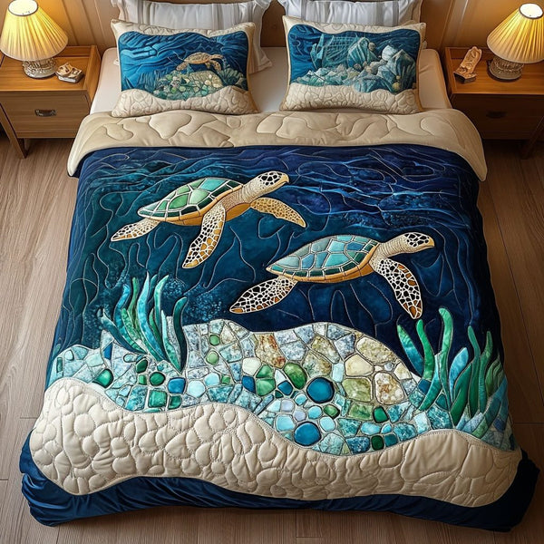 Deep Blue Mosaic quilted 3-piece bedding set on a made bed with two matching pillow shams