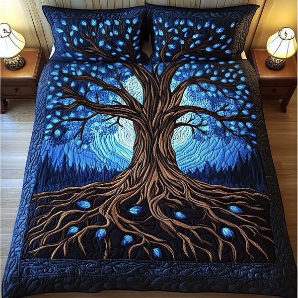 Deep Blue Rooted Tree quilted 3-piece bedding set on a made bed with two matching pillow shams