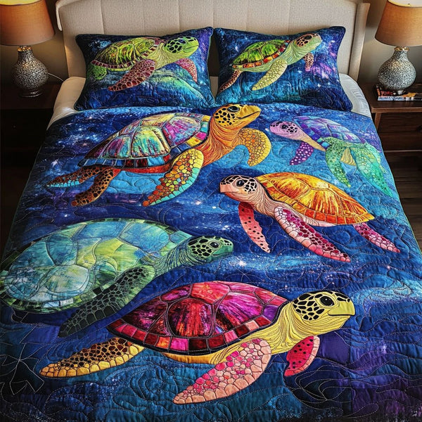 Deep Blue Serenity quilted 3-piece bedding set on a made bed with two matching pillow shams