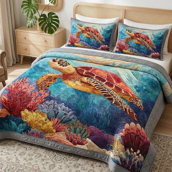 Deep Ocean quilted 3-piece bedding set on a made bed in a light coastal bedroom