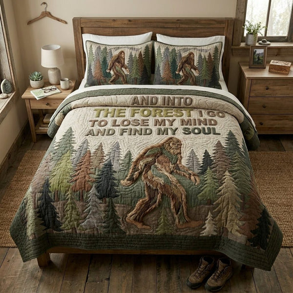 Deep Sasquatch quilted 3-piece bedding set on a made bed with two matching pillow shams