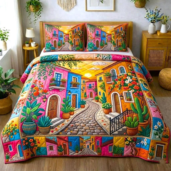 Desert Bloom quilted 3-piece bedding set on a made bed with two matching pillow shams