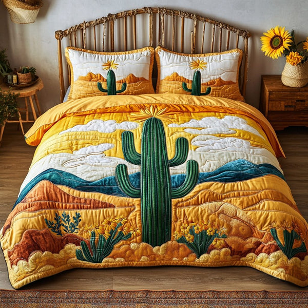 Desert Bloom quilted 3-piece bedding set on a made bed with two matching pillow shams